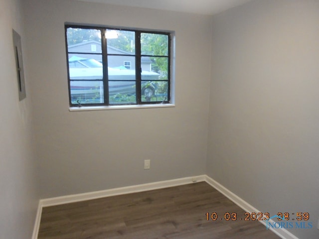 spare room featuring dark hardwood / wood-style floors