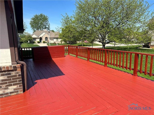 deck featuring a yard