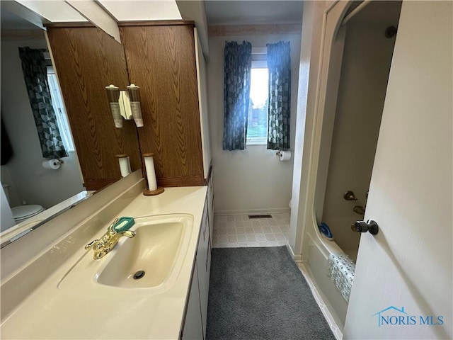 full bathroom with tile patterned flooring, vanity, toilet, and washtub / shower combination