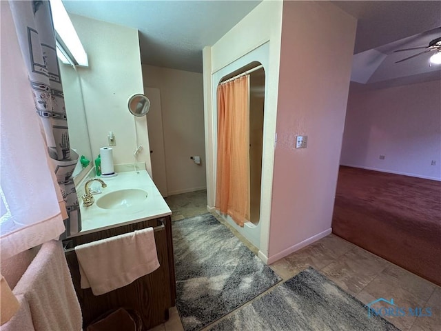 bathroom with ceiling fan and vanity