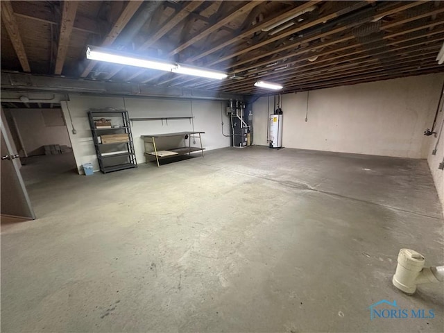 basement featuring gas water heater and heating unit