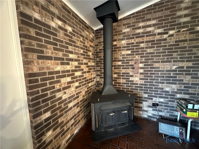 interior details featuring ornamental molding and a wood stove