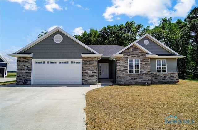 craftsman-style house with a front lawn and a garage