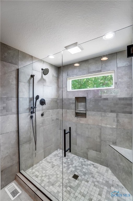 bathroom featuring an enclosed shower