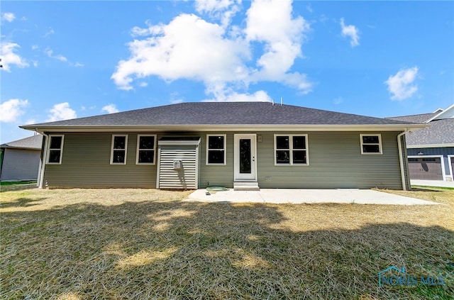 view of front of house featuring a front lawn and a patio area