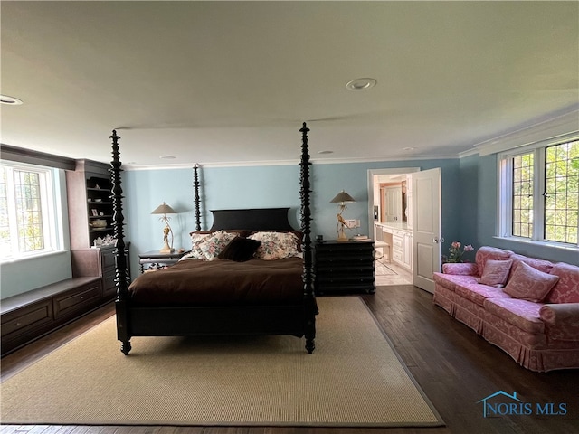 bedroom featuring hardwood / wood-style floors and ornamental molding