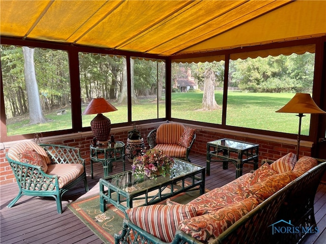 sunroom featuring vaulted ceiling