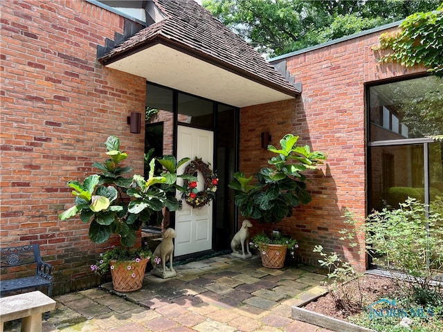 property entrance with a patio area