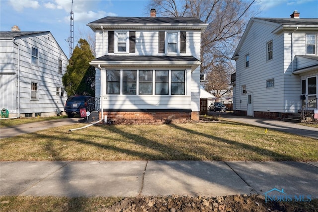 front facade with a front lawn