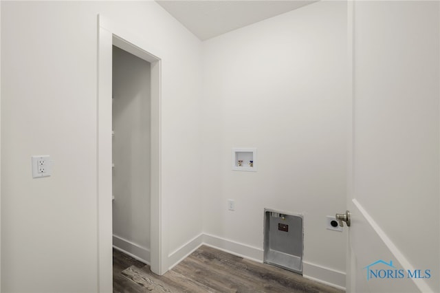 clothes washing area featuring dark wood-type flooring and washer hookup