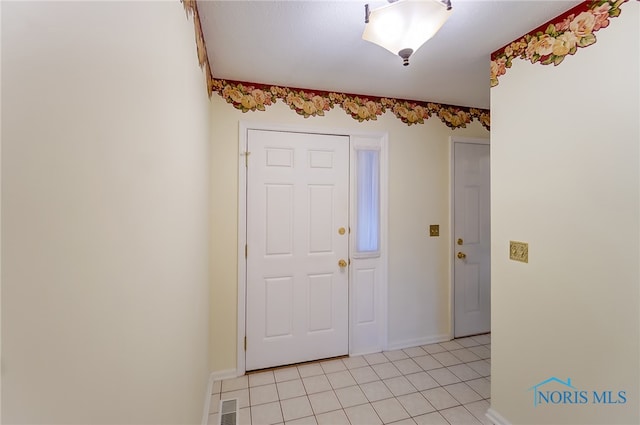 entryway featuring light tile floors