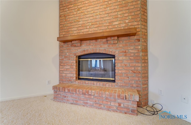 room details with carpet and a fireplace