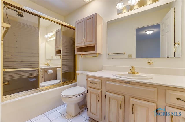 full bathroom featuring shower / bath combination with glass door, tile flooring, oversized vanity, and toilet