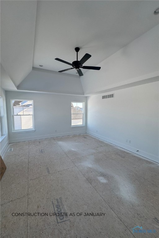 spare room featuring lofted ceiling and ceiling fan