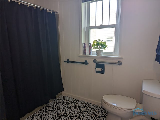 bathroom with tile patterned floors and toilet