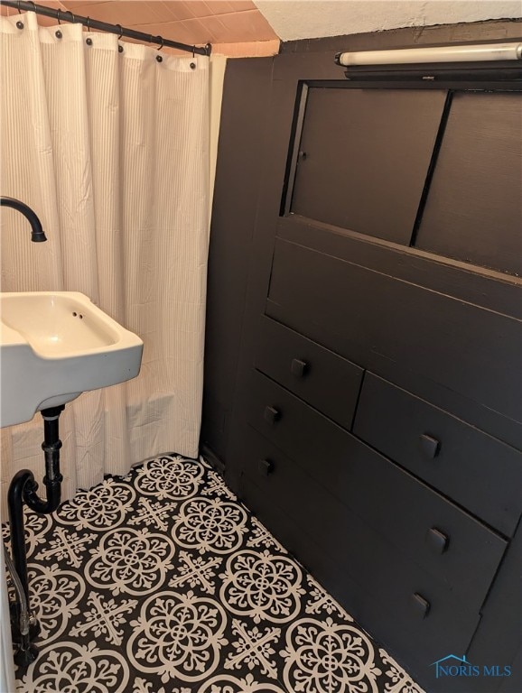 bathroom with tile patterned flooring