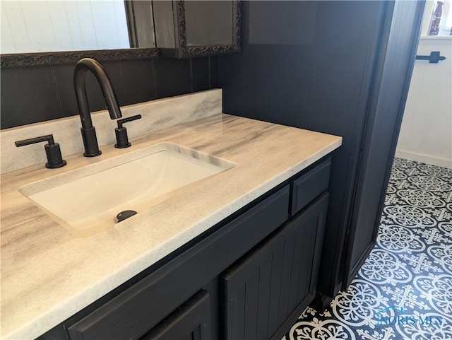 bathroom with vanity and tile patterned flooring