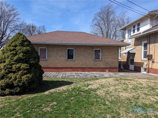 rear view of property with a yard