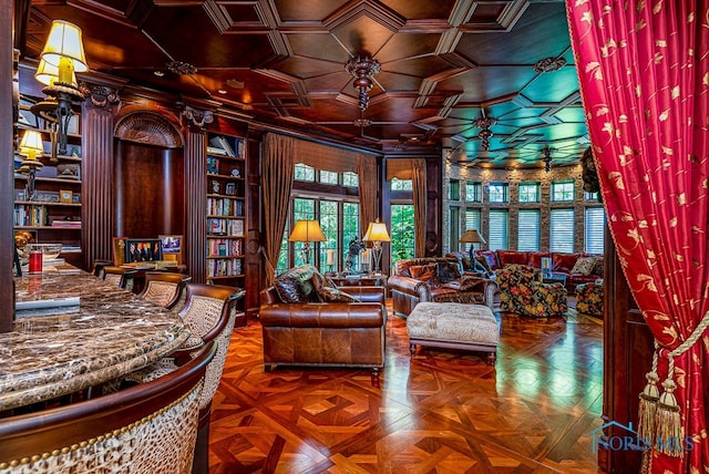 sitting room featuring ornamental molding, wood walls, parquet floors, and coffered ceiling