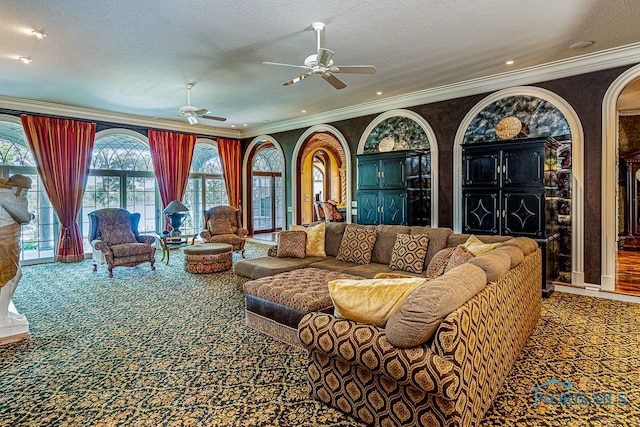 carpeted living room with ceiling fan, a textured ceiling, and crown molding