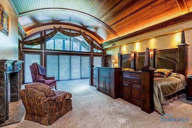 carpeted bedroom with wood ceiling and vaulted ceiling