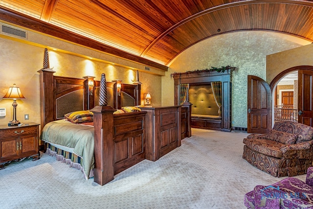 bedroom with light colored carpet, wood ceiling, and vaulted ceiling