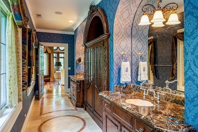 bathroom with vanity and crown molding