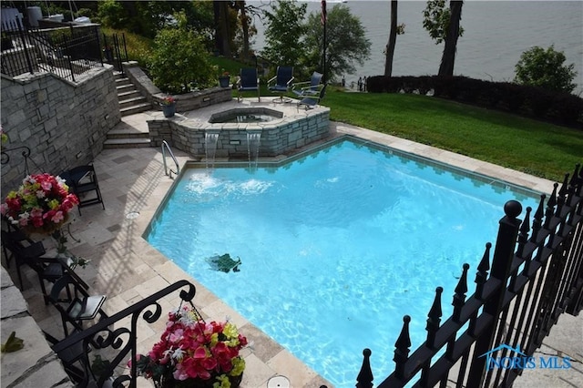 view of swimming pool featuring a water view, a patio, an in ground hot tub, and a yard