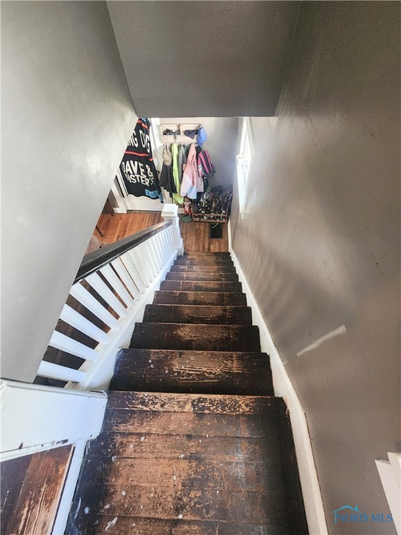 stairway featuring dark hardwood / wood-style flooring