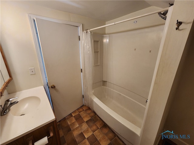 bathroom featuring tile flooring, vanity, and shower / bath combo with shower curtain