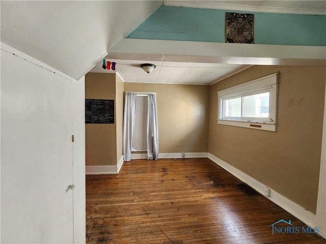 spare room featuring dark hardwood / wood-style flooring