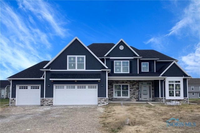 craftsman-style home with a porch and a garage