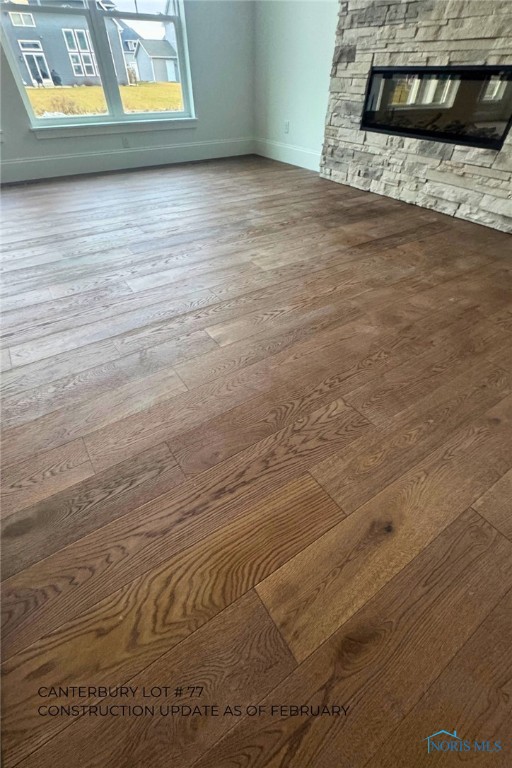 interior space with hardwood / wood-style floors and a fireplace