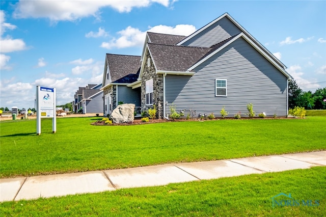 view of home's exterior with a yard