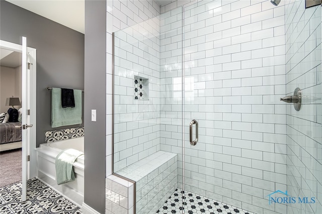 bathroom with tile patterned floors and separate shower and tub