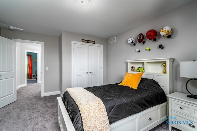 bedroom featuring a closet and light colored carpet