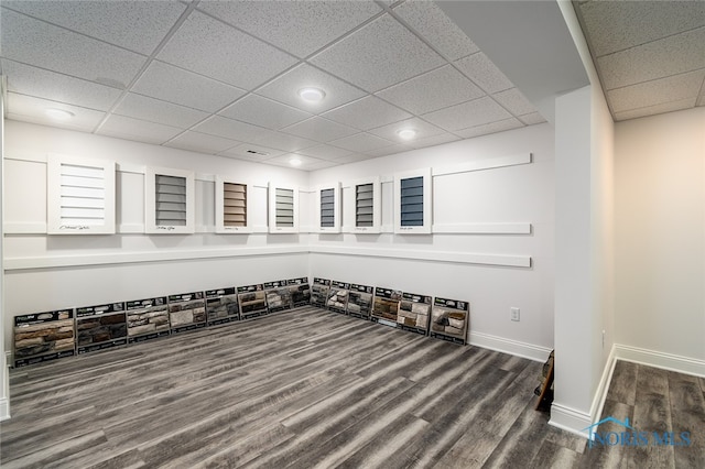 interior space with hardwood / wood-style floors and a paneled ceiling