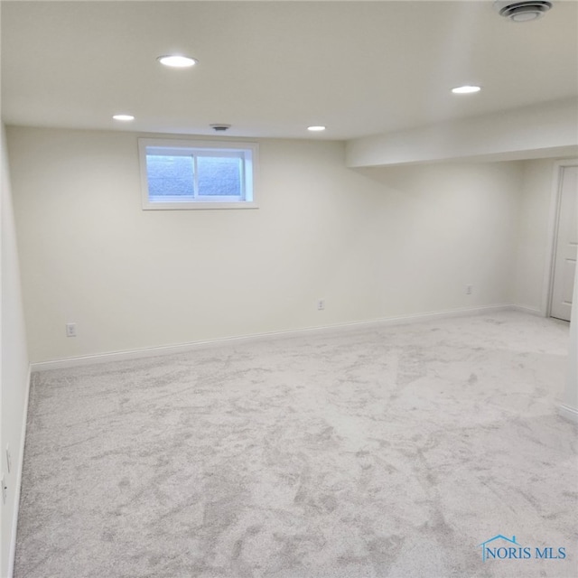 basement with light colored carpet