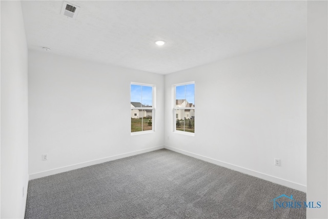 empty room with carpet flooring