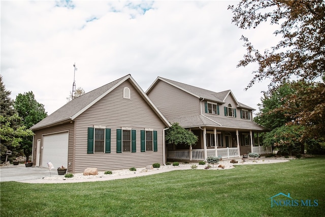 view of front of home with a garage, a porch, and a front yard