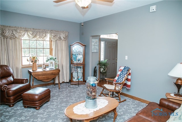 living area featuring ceiling fan