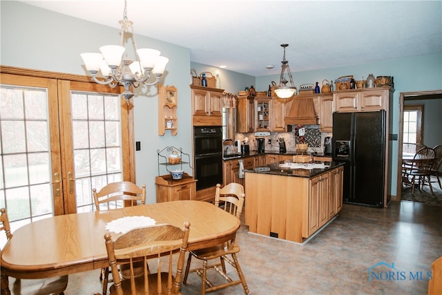 kitchen featuring tile patterned floors, pendant lighting, black appliances, and decorative backsplash