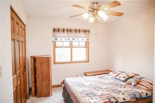 carpeted bedroom featuring a closet and ceiling fan