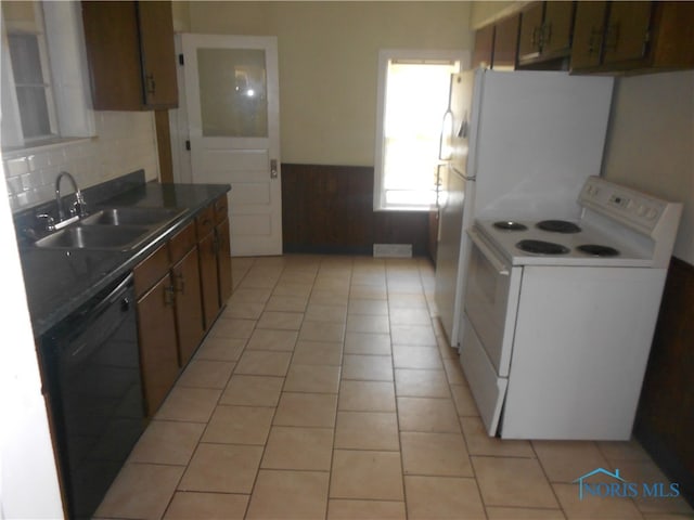 kitchen featuring dishwasher, light tile floors, sink, and white electric range