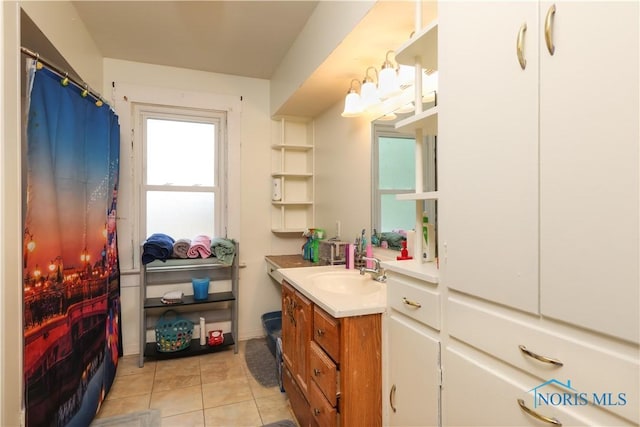 bathroom with tile patterned flooring and vanity