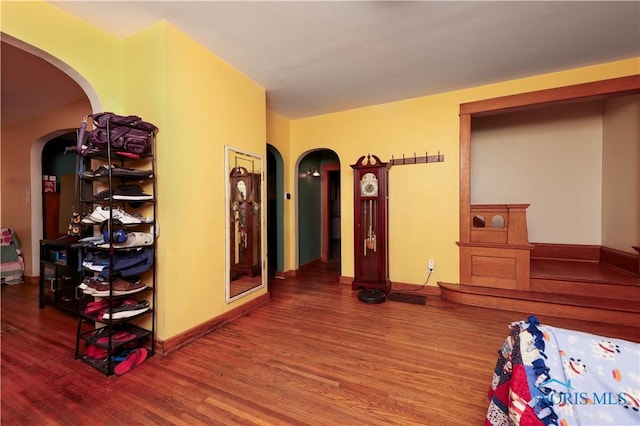 bedroom with hardwood / wood-style floors