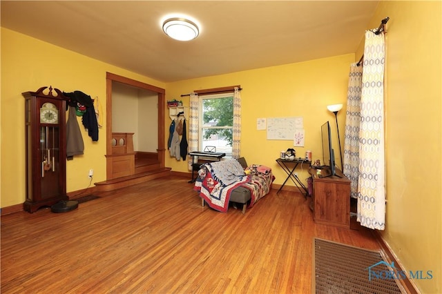 sitting room with hardwood / wood-style flooring