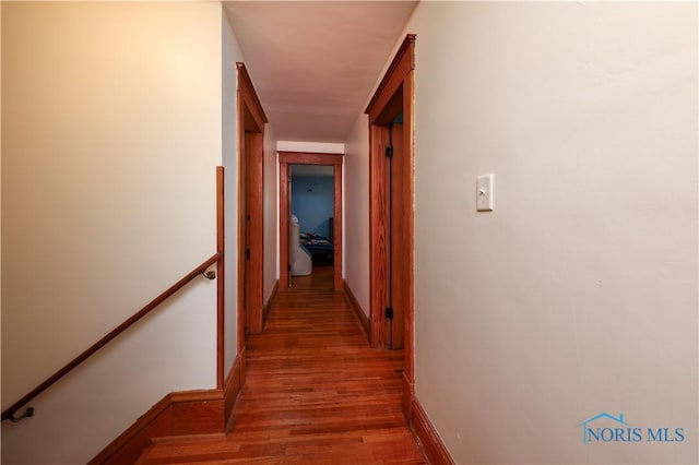 corridor featuring wood-type flooring