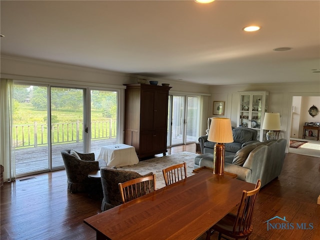 dining room with dark hardwood / wood-style floors