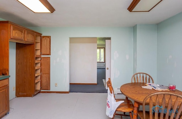 dining room featuring baseboard heating